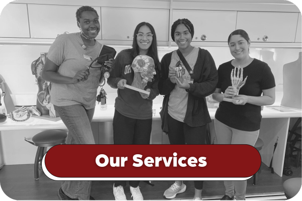 Black and white image of four smiling students standing in the Health Sciences Explorer each holding a different anatomical model. Title on image says Our Services.